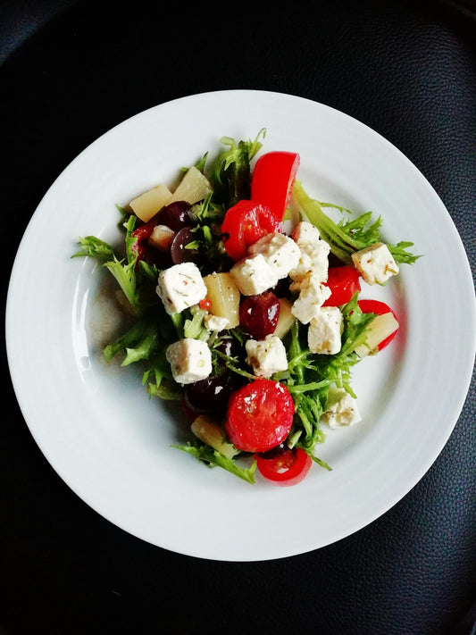 Fresh colorful salad with mixed greens and vegetables in a bowl